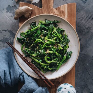 Homemade stir-fried pea shoots with garlic